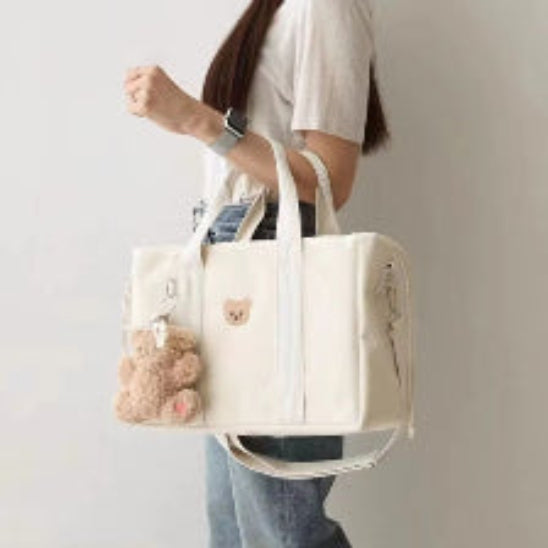 main qui tient sac a langer